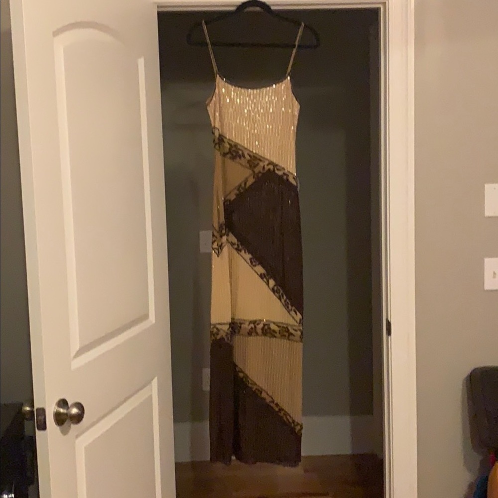 Long beaded sleeveless dress.